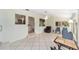 Large sunroom with views of the kitchen and other living spaces and access to the backyard at 1179 Se 170Th Ct, Silver Springs, FL 34488