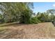 Large, open yard with mature trees offers ample space for outdoor activities and gardening at 1179 Se 170Th Ct, Silver Springs, FL 34488