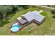 Aerial view of the home with a large backyard and pool at 14171 Sw 8Th Ave, Ocala, FL 34473