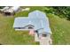 Aerial view of the home showcasing the front yard and roof at 14171 Sw 8Th Ave, Ocala, FL 34473