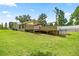 Expansive backyard featuring a wooden deck and above-ground pool at 14171 Sw 8Th Ave, Ocala, FL 34473