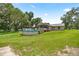 Large backyard with an above-ground pool and screened-in porch at 14171 Sw 8Th Ave, Ocala, FL 34473
