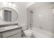 This bathroom features a tub, shower, toilet and sink with a large mirror at 14171 Sw 8Th Ave, Ocala, FL 34473