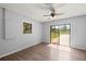 Bright bedroom with wood flooring and sliding glass doors to enjoy the backyard view at 14171 Sw 8Th Ave, Ocala, FL 34473