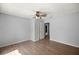 A roomy bedroom showcasing wood flooring and a neutral paint scheme at 14171 Sw 8Th Ave, Ocala, FL 34473