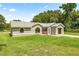 Attractive single-story home with well-kept lawn and stucco exterior at 14171 Sw 8Th Ave, Ocala, FL 34473