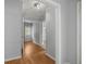 Hallway with exterior exit, French doors, and light-toned wood-look flooring at 14171 Sw 8Th Ave, Ocala, FL 34473