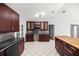 Updated kitchen with stainless appliances, an island, dark countertops and stylish cabinets at 14171 Sw 8Th Ave, Ocala, FL 34473