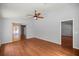 Hardwood floors and a ceiling fan enhance this light filled living room at 14171 Sw 8Th Ave, Ocala, FL 34473
