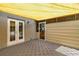 Covered patio featuring double doors and additional doorway to the backyard at 14171 Sw 8Th Ave, Ocala, FL 34473