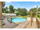 Backyard featuring a deck around an above ground swimming pool at 14171 Sw 8Th Ave, Ocala, FL 34473