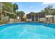 Above-ground pool with surrounding deck and cabana, perfect for outdoor entertaining at 14171 Sw 8Th Ave, Ocala, FL 34473