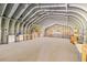 Spacious workshop featuring a metal roof with abundant lighting and built in shelving at 14171 Sw 8Th Ave, Ocala, FL 34473