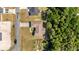 A bird's eye view of a house with a long driveway surrounded by green foliage at 15087 Sw 43Rd Ct, Ocala, FL 34473