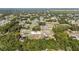 A high-angle view reveals well-spaced homes within a community and surrounding lush greenery at 15087 Sw 43Rd Ct, Ocala, FL 34473