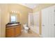 Bathroom with single vanity, mirror, tub/shower combo, and tile flooring at 15087 Sw 43Rd Ct, Ocala, FL 34473