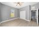 Bedroom featuring laminate flooring, closet, neutral paint and a ceiling fan at 15087 Sw 43Rd Ct, Ocala, FL 34473