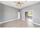 This bedroom offers a ceiling fan, a large closet, and ample natural light from a window at 15087 Sw 43Rd Ct, Ocala, FL 34473