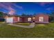 Charming single-Gathering home with a lush green lawn and a two-car garage at 15087 Sw 43Rd Ct, Ocala, FL 34473