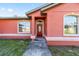 Close-up of the front door framed by arched windows and attractive trim at 15087 Sw 43Rd Ct, Ocala, FL 34473