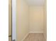 Narrow hallway with laminate flooring and neutral paint at 15087 Sw 43Rd Ct, Ocala, FL 34473