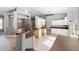 Spacious kitchen with brown countertops, white cabinets, and stainless steel sink at 15087 Sw 43Rd Ct, Ocala, FL 34473