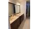 Bathroom with double sink vanity offering ample storage and countertop space at 15266 Sw 44Th Ter, Ocala, FL 34473