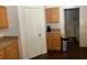 Well-organized kitchen area with stainless steel appliances, wood cabinets, and convenient access to a laundry room at 15266 Sw 44Th Ter, Ocala, FL 34473