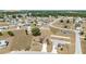 Explore this peaceful community from above, featuring lovely homes amidst green spaces and quiet roads at 173 Juniper Way, Ocala, FL 34480