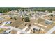 Experience the beauty of this neighborhood from an aerial perspective, with charming homes and lush surroundings at 173 Juniper Way, Ocala, FL 34480