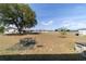 Spacious backyard with mature tree and large open space, perfect for outdoor activities at 173 Juniper Way, Ocala, FL 34480