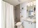 This updated bathroom has a tiled shower, a modern vanity, and an open design for accessibility and convenience at 173 Juniper Way, Ocala, FL 34480