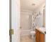 Cozy bathroom includes a shower-tub combo, neutral tile, and a single-sink vanity, creating a functional space at 173 Juniper Way, Ocala, FL 34480