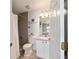 Bathroom features a tiled shower, a modern vanity, and an open design for accessibility and convenience at 173 Juniper Way, Ocala, FL 34480