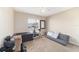 Neutral bedroom featuring an exercise bike, weights, and natural light, providing a flexible living space at 173 Juniper Way, Ocala, FL 34480