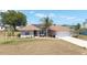 Charming home with a well-maintained front yard, complemented by a cozy porch at 173 Juniper Way, Ocala, FL 34480
