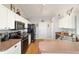 Galley style kitchen with stainless steel appliances and light countertops at 173 Juniper Way, Ocala, FL 34480