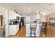 Kitchen with stainless steel appliances, a breakfast bar, and easy access to dining at 173 Juniper Way, Ocala, FL 34480