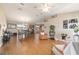 Spacious living room with wood floors, dining area and a ceiling fan providing comfort and style at 173 Juniper Way, Ocala, FL 34480