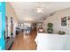 Bright, open-concept living and dining area with hardwood floors and natural light, perfect for entertaining at 173 Juniper Way, Ocala, FL 34480