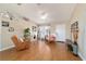 Inviting living room featuring wood floors, lots of natural light, and comfortable furnishings at 173 Juniper Way, Ocala, FL 34480