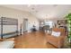 Open living area with wood floors, comfortable seating, and a dining area for easy living at 173 Juniper Way, Ocala, FL 34480