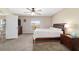 Bedroom features a ceiling fan, a window and ample closet space at 173 Juniper Way, Ocala, FL 34480