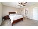Bedroom with ceiling fan, natural light, and adjacent bathroom at 173 Juniper Way, Ocala, FL 34480