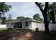 Backyard showcasing a covered patio and large fenced-in yard at 18 Larch Radl, Ocala, FL 34480