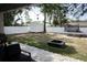 View of the private backyard with shed, trampoline, playground, and fire pit at 18 Larch Radl, Ocala, FL 34480