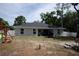 Spacious backyard featuring a large fenced-in yard and shaded patio area at 18 Larch Radl, Ocala, FL 34480