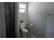 Bathroom featuring a toilet, walk-in shower, and window, providing natural light at 18 Larch Radl, Ocala, FL 34480