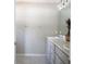 Well-lit bathroom with a double sink vanity, neutral color palette, and chrome hardware at 18 Larch Radl, Ocala, FL 34480