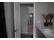Bathroom featuring a gray countertop vanity with flowers on the counter at 18 Larch Radl, Ocala, FL 34480